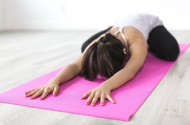 woman-doing-yoga-pose-on-pink-yoga-mat-374589-1.jpg