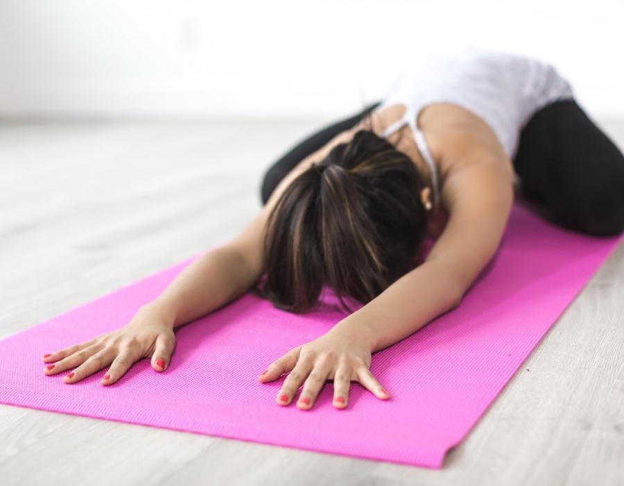 woman-doing-yoga-pose-on-pink-yoga-mat-374589-1.jpg